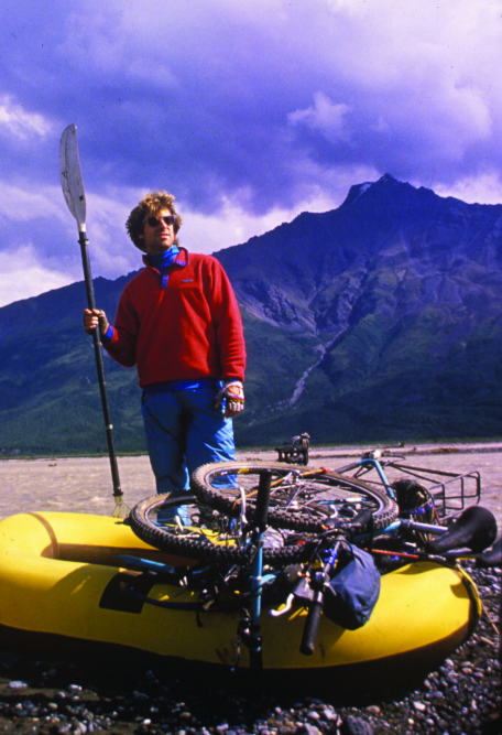 What is bikerafting? Roman Dial on his first Hellbike trip crossing the Nabesna River with Carl and Jon's bikes on his boat, 1988. Photo courtesy of Roman Dial.