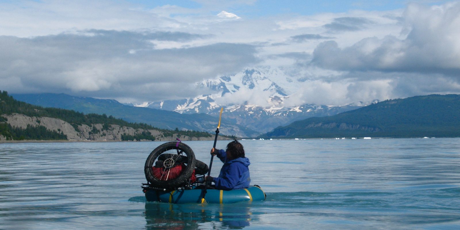Dylan Kentch paddling across Icy Bay, by Eric Parsons. This photo appears in The Bikeraft Guide.